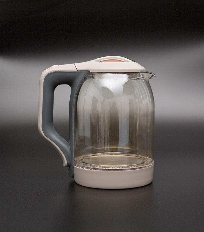 Are there any precautions I should take when using and handling a glass electric kettle?